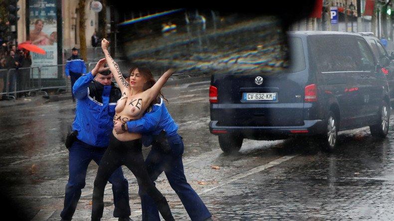 «Фальшивий миротворець»: активіска Femen вибігла на дорогу перед кортежем Трампа